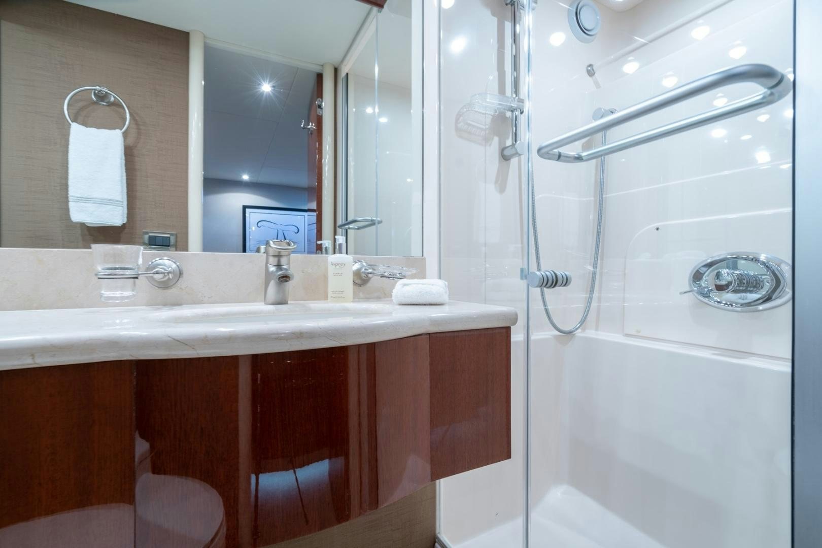 a bathroom with a glass shower aboard SUMMERWIND Yacht for Sale