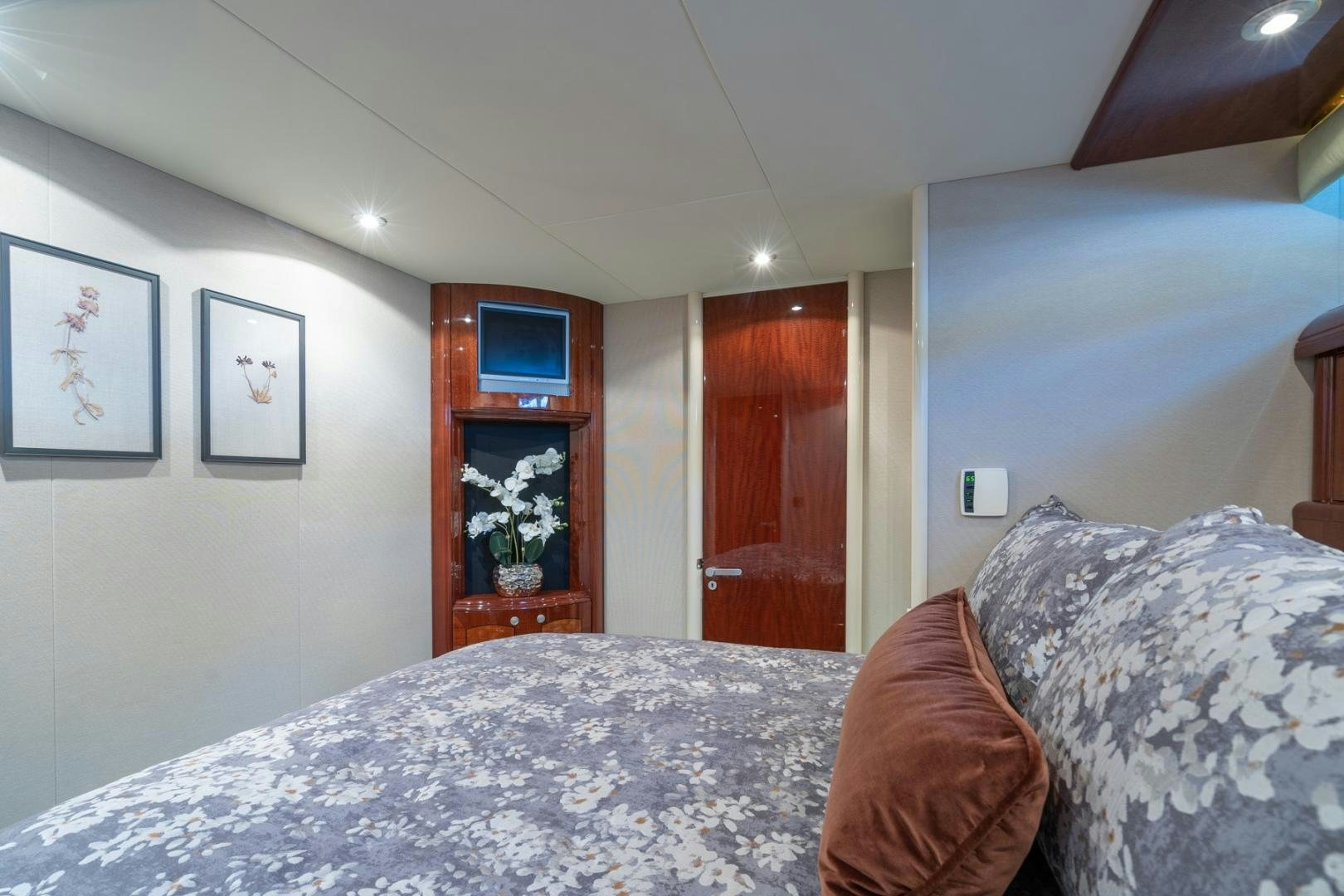 a bedroom with a bed and a television aboard SUMMERWIND Yacht for Sale