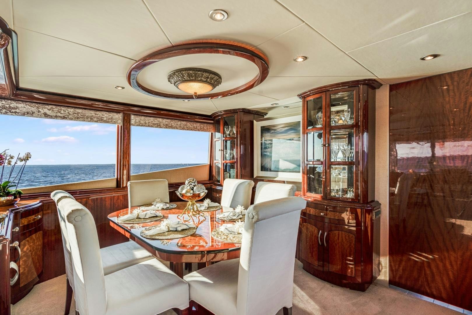 a dining room with a large window aboard SUMMERWIND Yacht for Sale