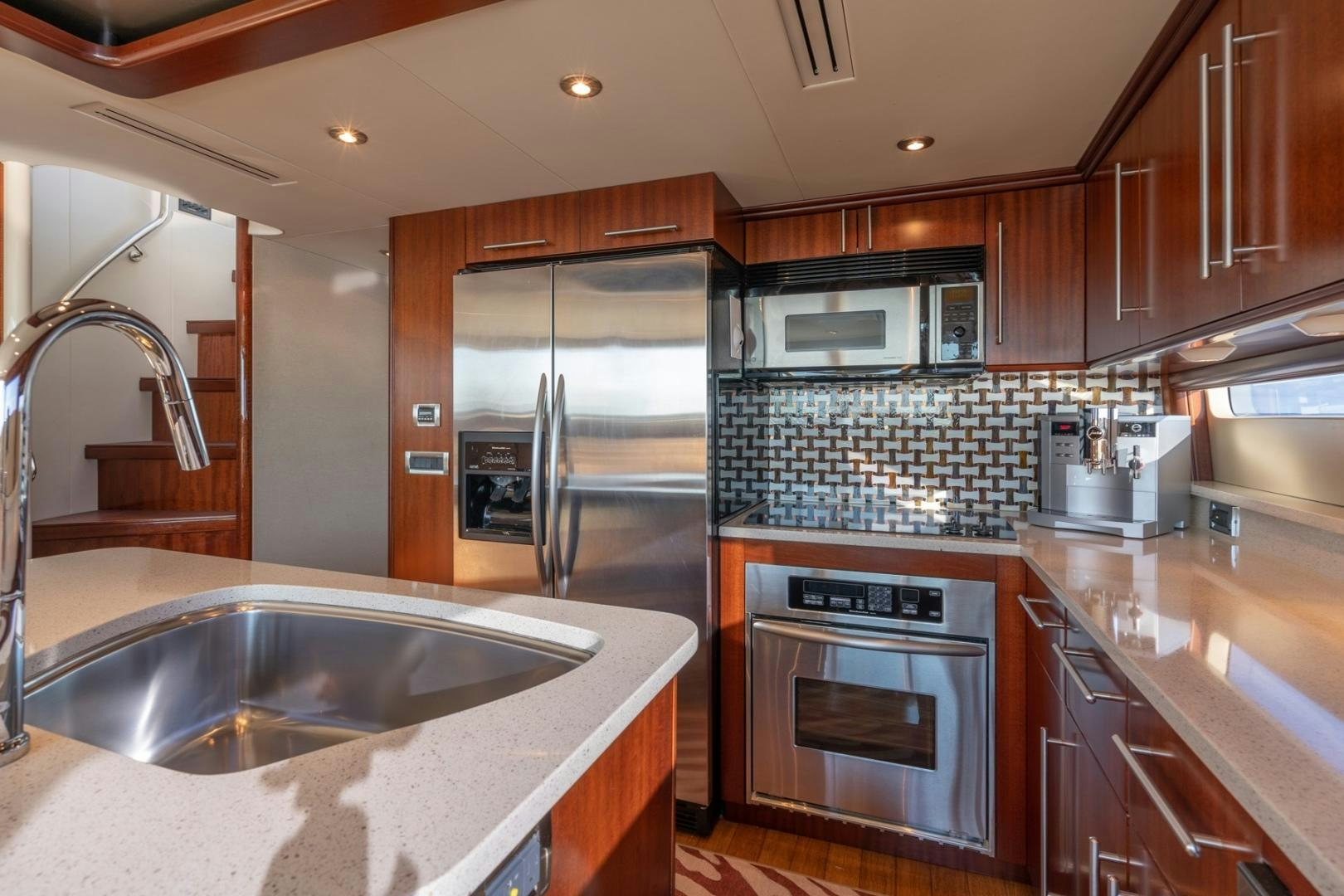 a kitchen with a sink and stove aboard SUMMERWIND Yacht for Sale