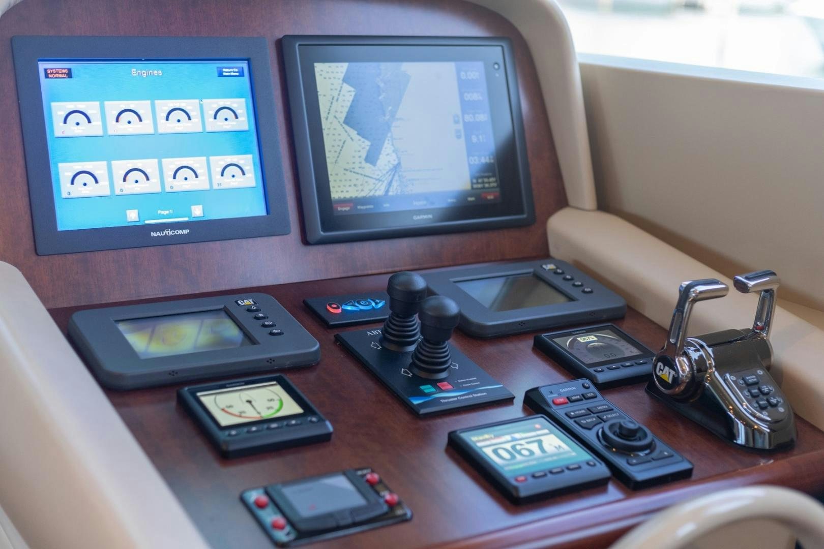 a desk with a computer and cell phones on it aboard SUMMERWIND Yacht for Sale