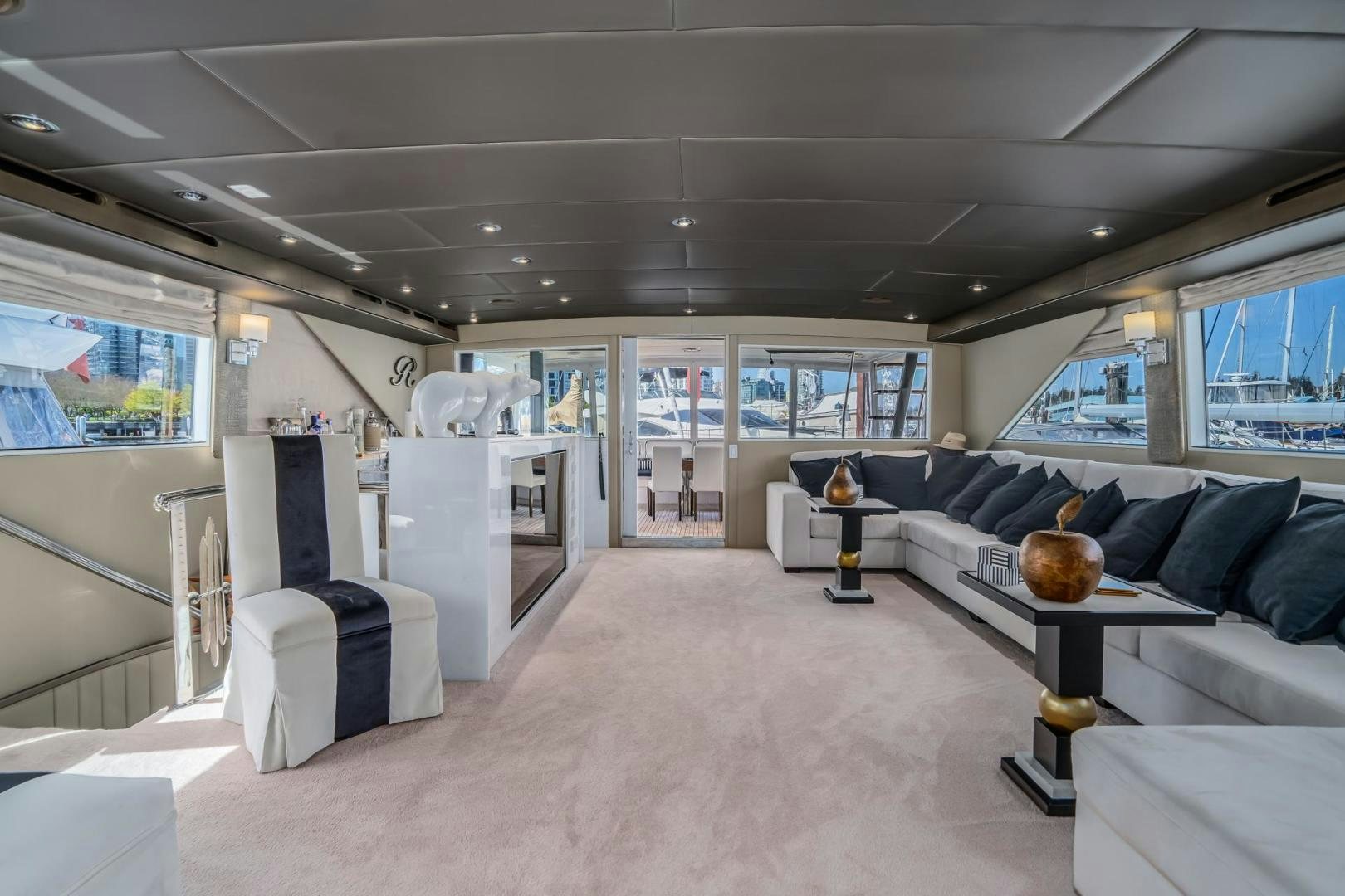 a room with a couch and a table aboard SOVEREIGN LADY Yacht for Sale
