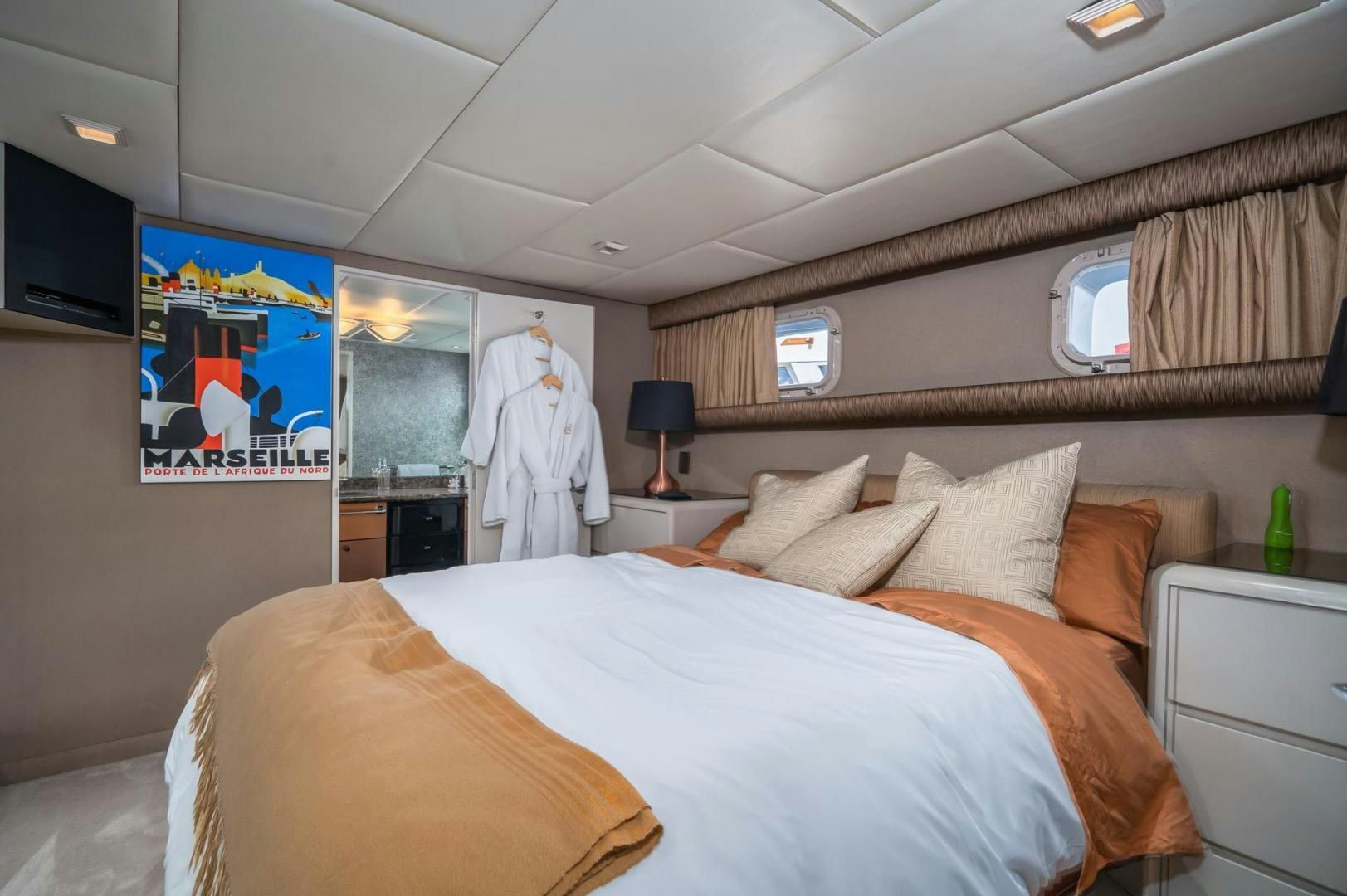 a room with a bed and a television aboard SOVEREIGN LADY Yacht for Sale