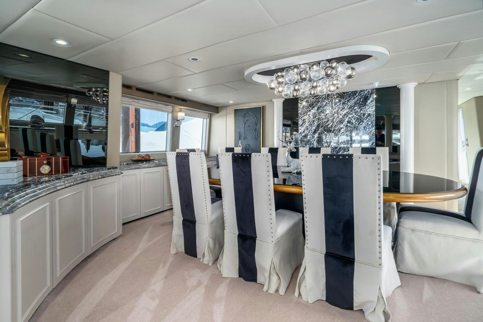 a large kitchen with white cabinets aboard SOVEREIGN LADY Yacht for Sale