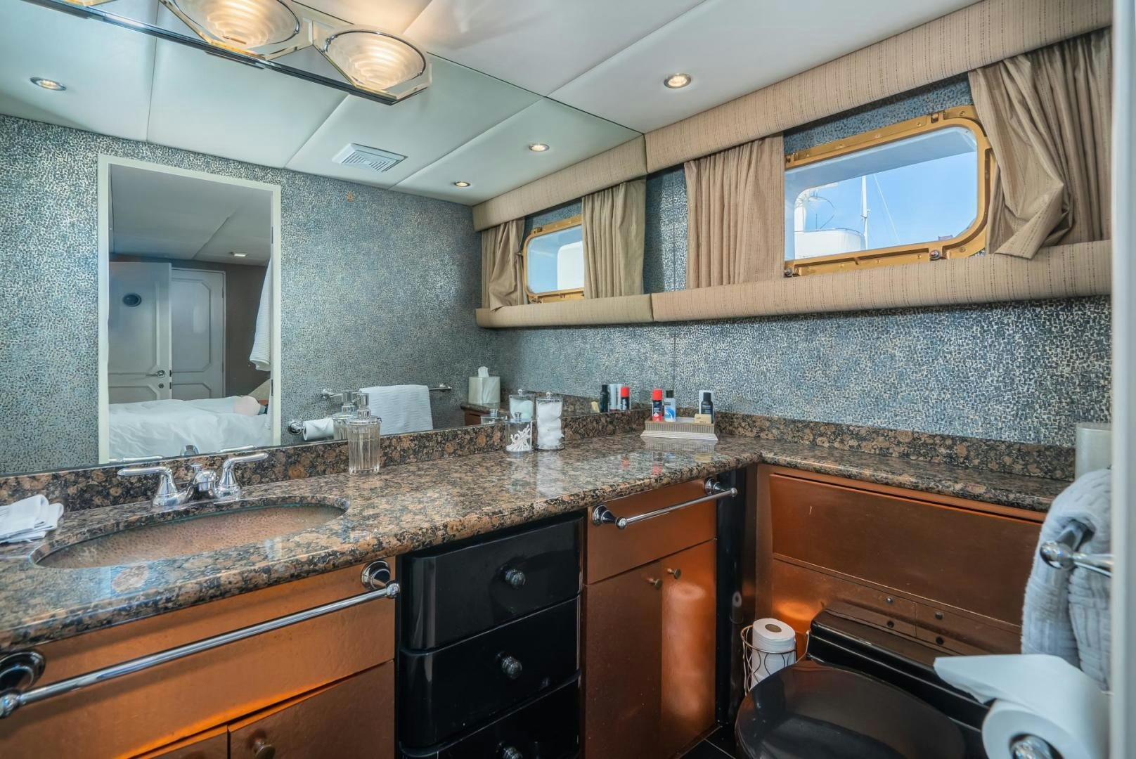 a bathroom with marble counters aboard SOVEREIGN LADY Yacht for Sale