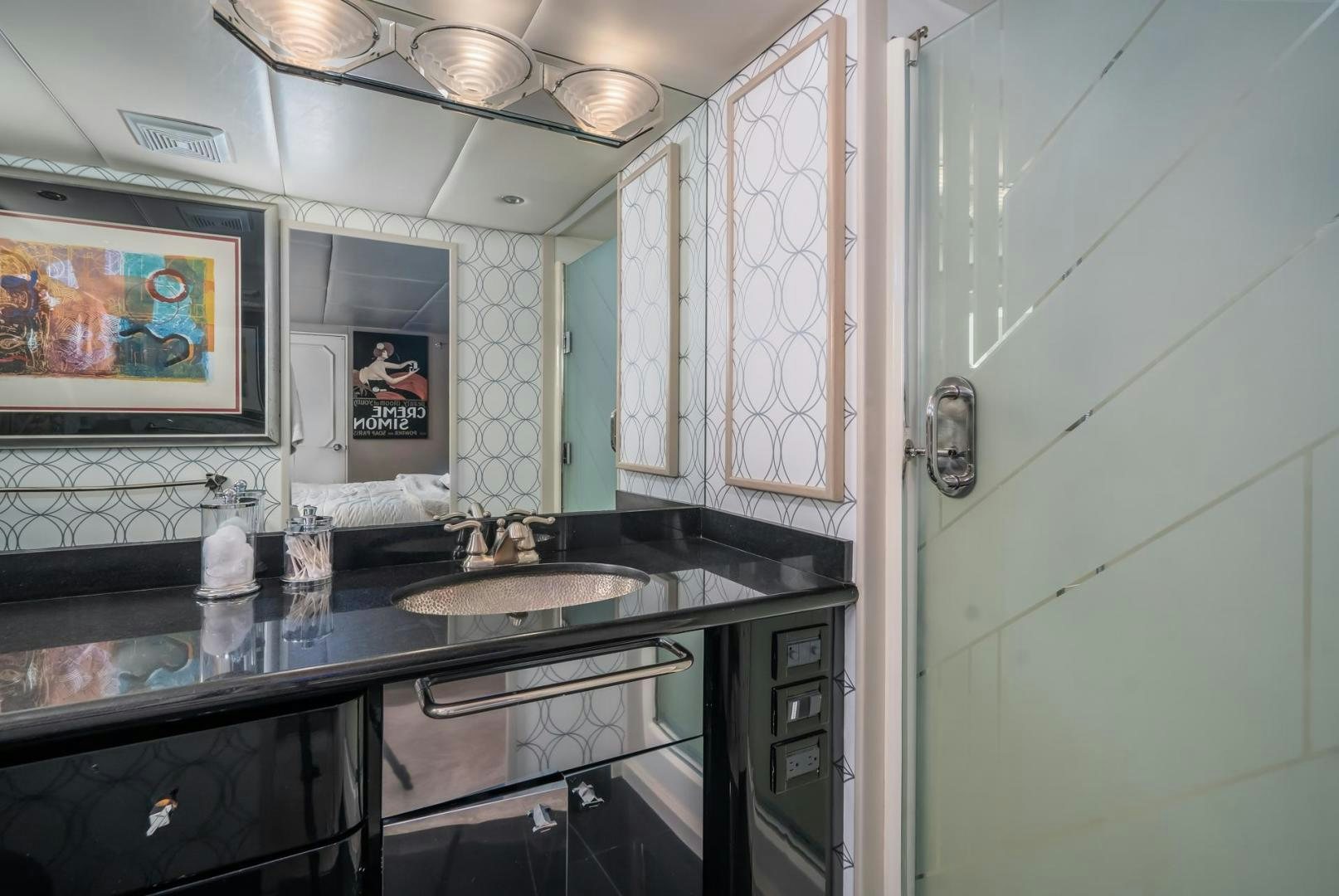 a kitchen with a sink and a mirror aboard SOVEREIGN LADY Yacht for Sale