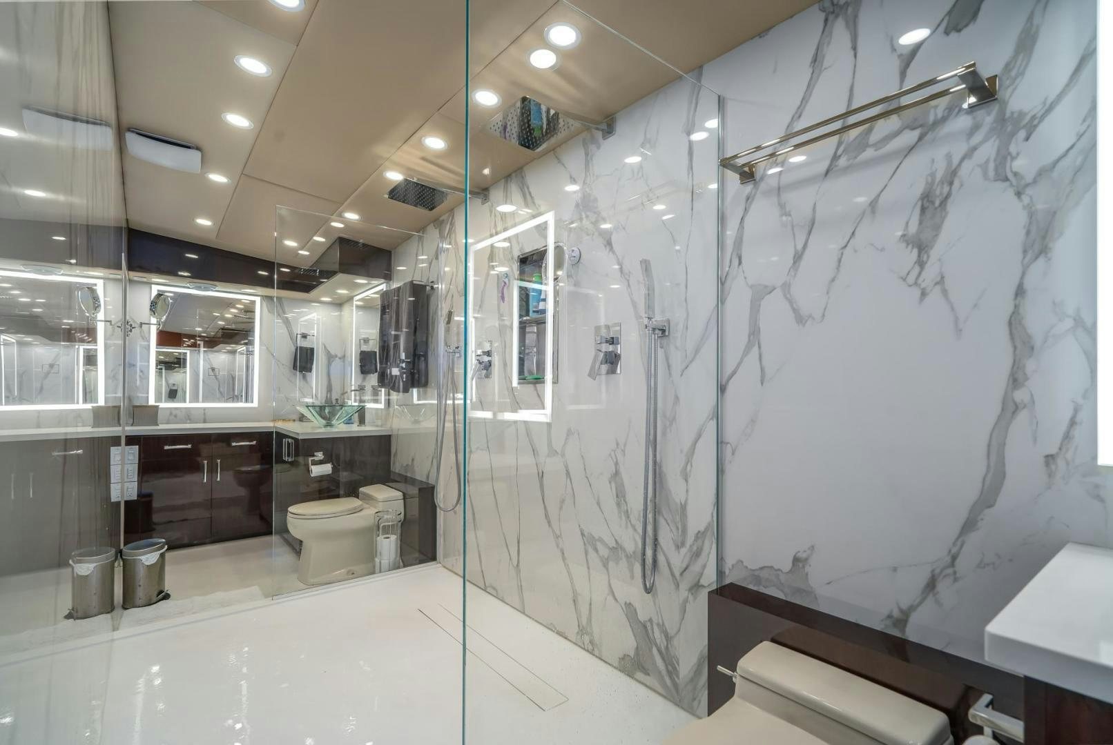 a bathroom with a glass shower aboard SOVEREIGN LADY Yacht for Sale
