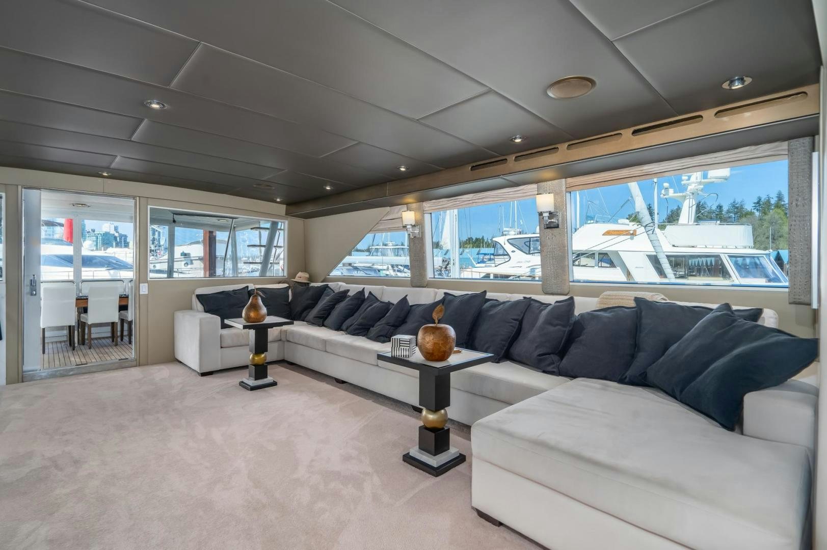 a living room with a couch and a coffee table aboard SOVEREIGN LADY Yacht for Sale