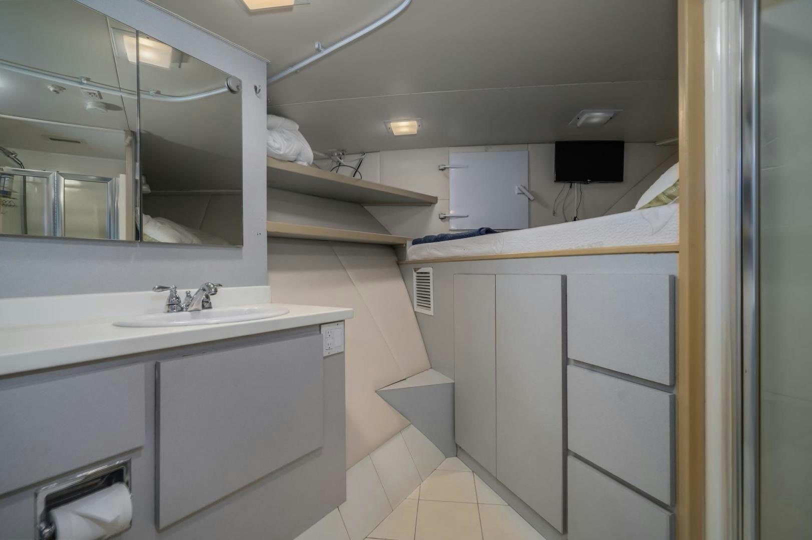 a bathroom with white cabinets aboard SOVEREIGN LADY Yacht for Sale