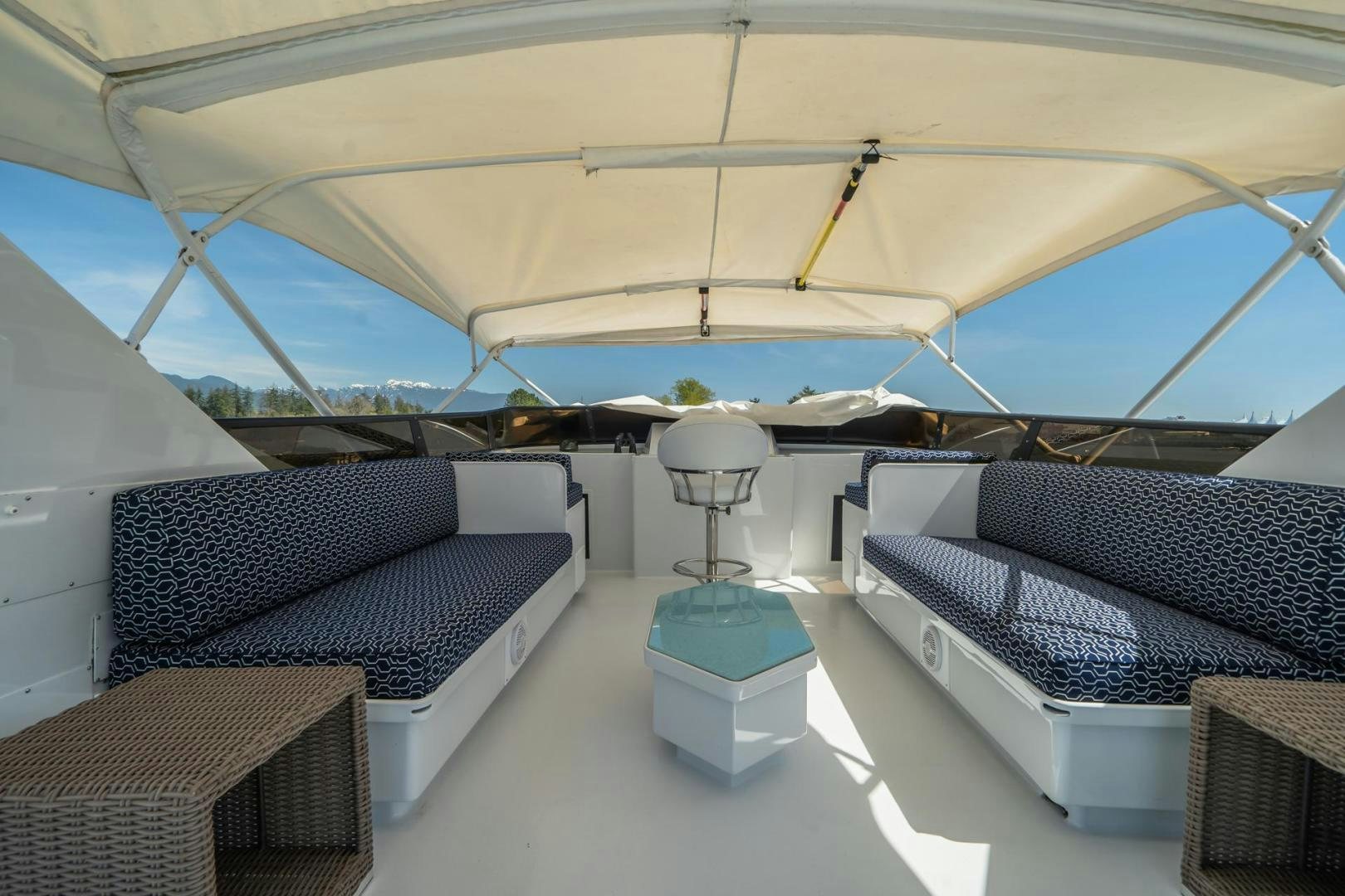 a tent with couches and a table aboard SOVEREIGN LADY Yacht for Sale