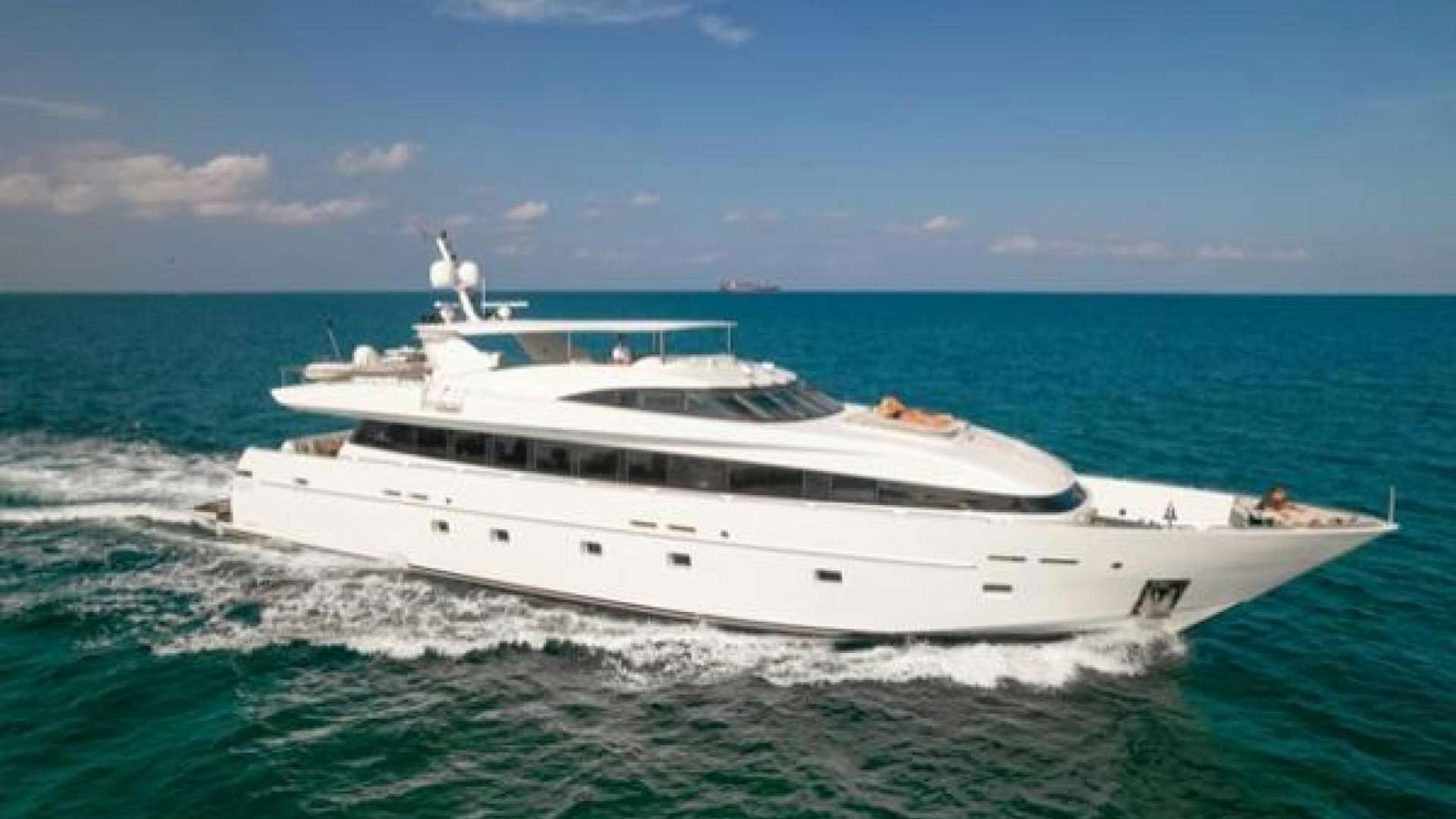 a white yacht in the water aboard REX Yacht for Sale