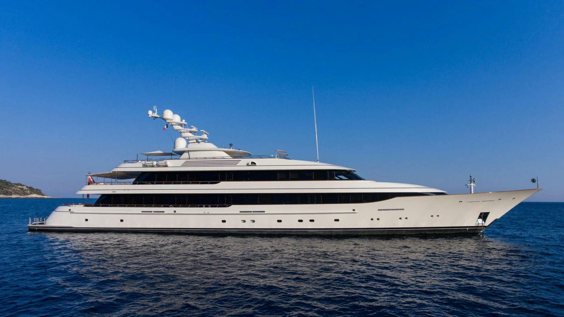 a large white yacht in the water aboard DRIZZLE Yacht for Sale