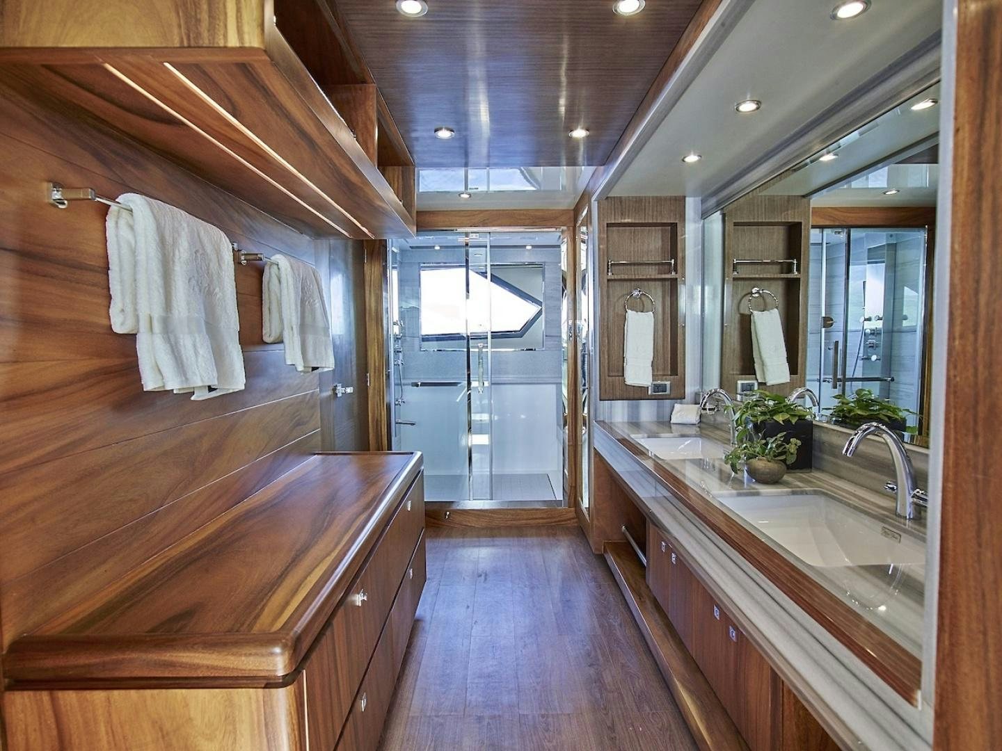 a bathroom with a wood floor aboard ALAIA Yacht for Sale