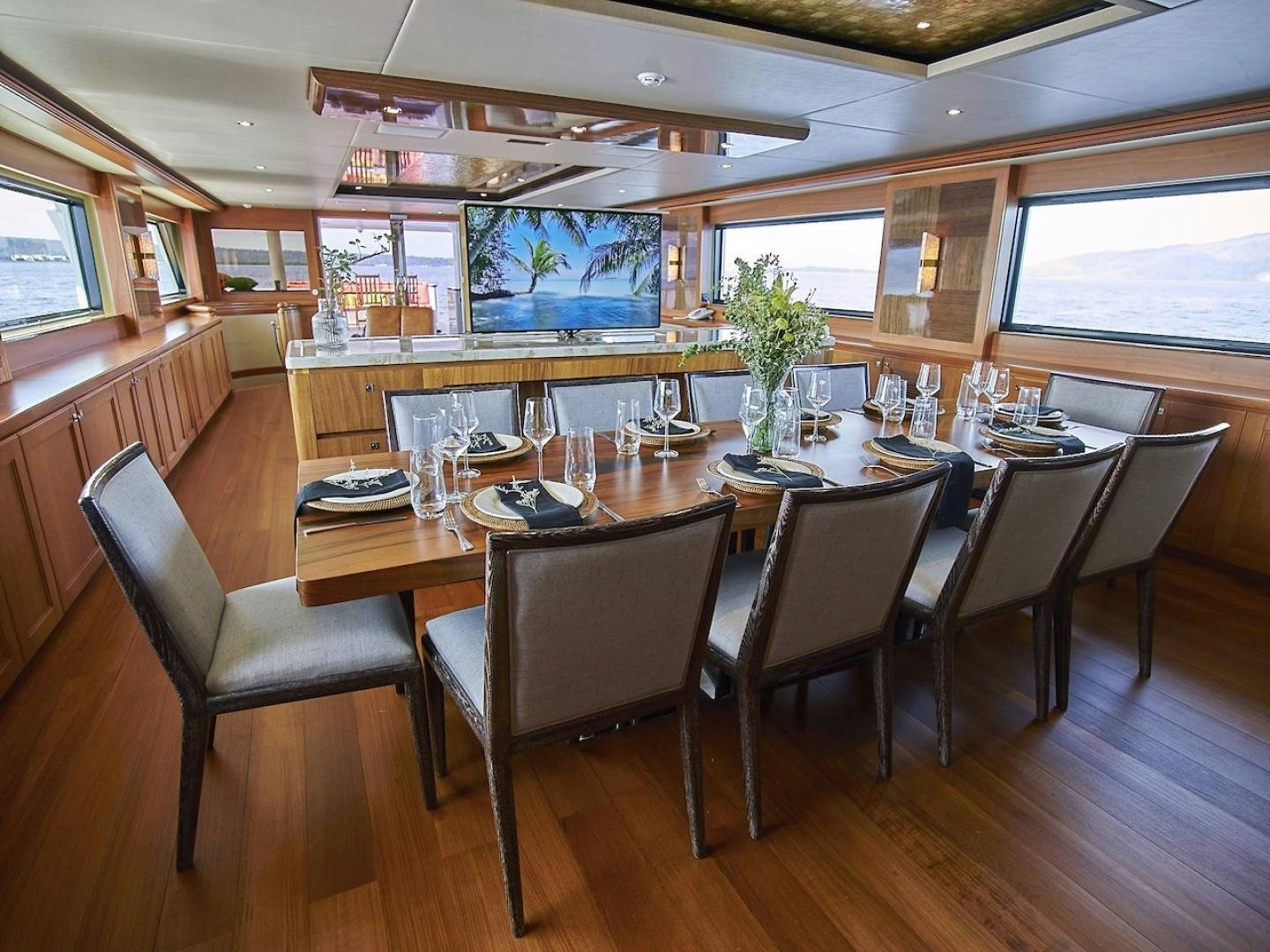 a large dining table in a restaurant aboard ALAIA Yacht for Sale