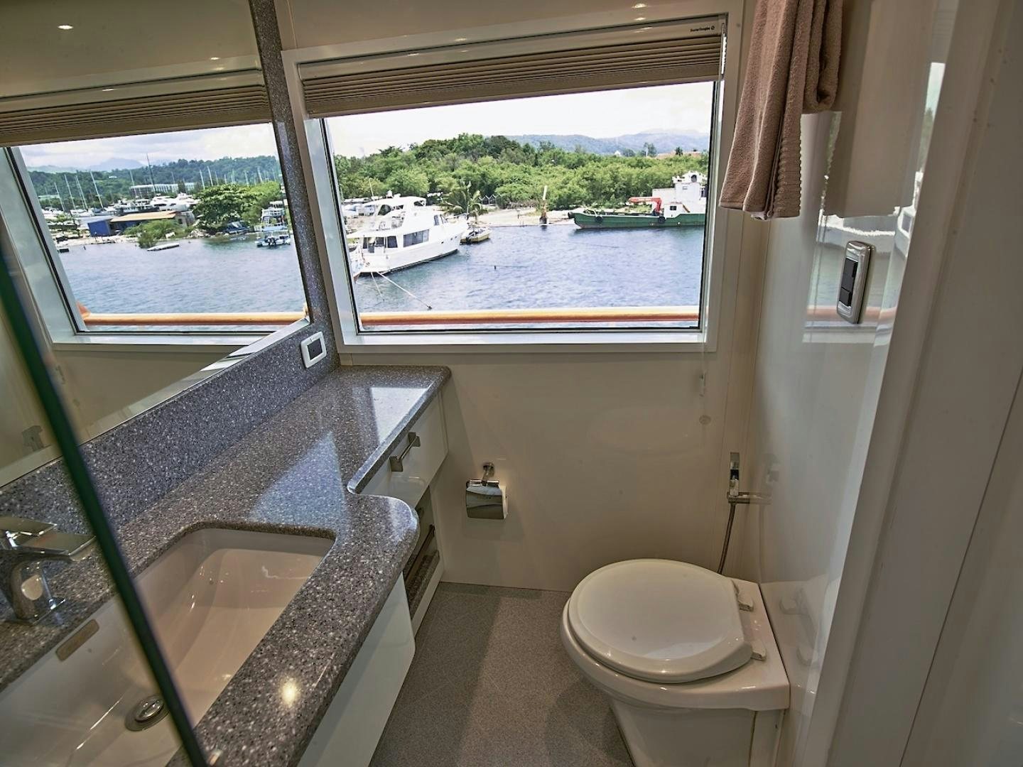 a bathroom with a large window aboard ALAIA Yacht for Sale