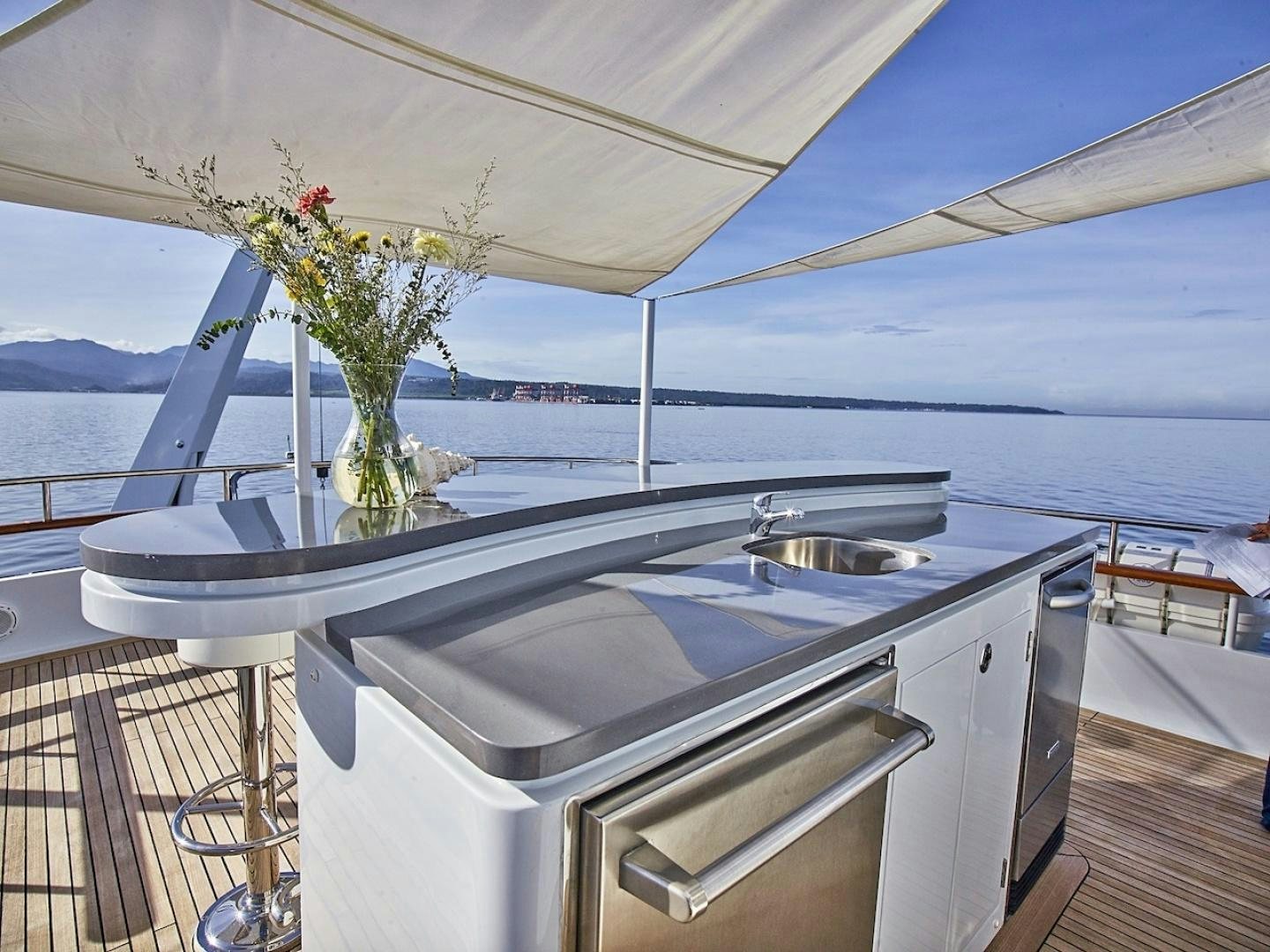 a kitchen with a sink and a plant on the counter aboard ALAIA Yacht for Sale