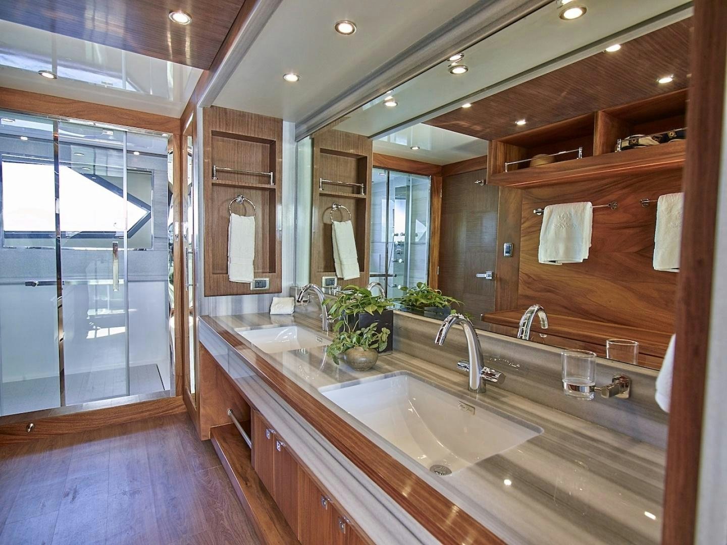 a bathroom with a large mirror aboard ALAIA Yacht for Sale