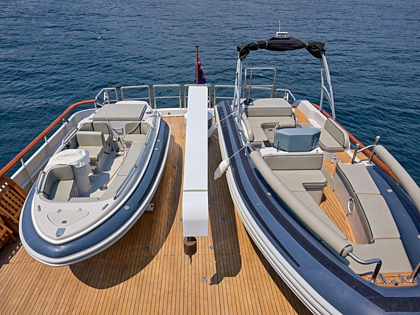 a couple of boats on a dock aboard ALAIA Yacht for Sale