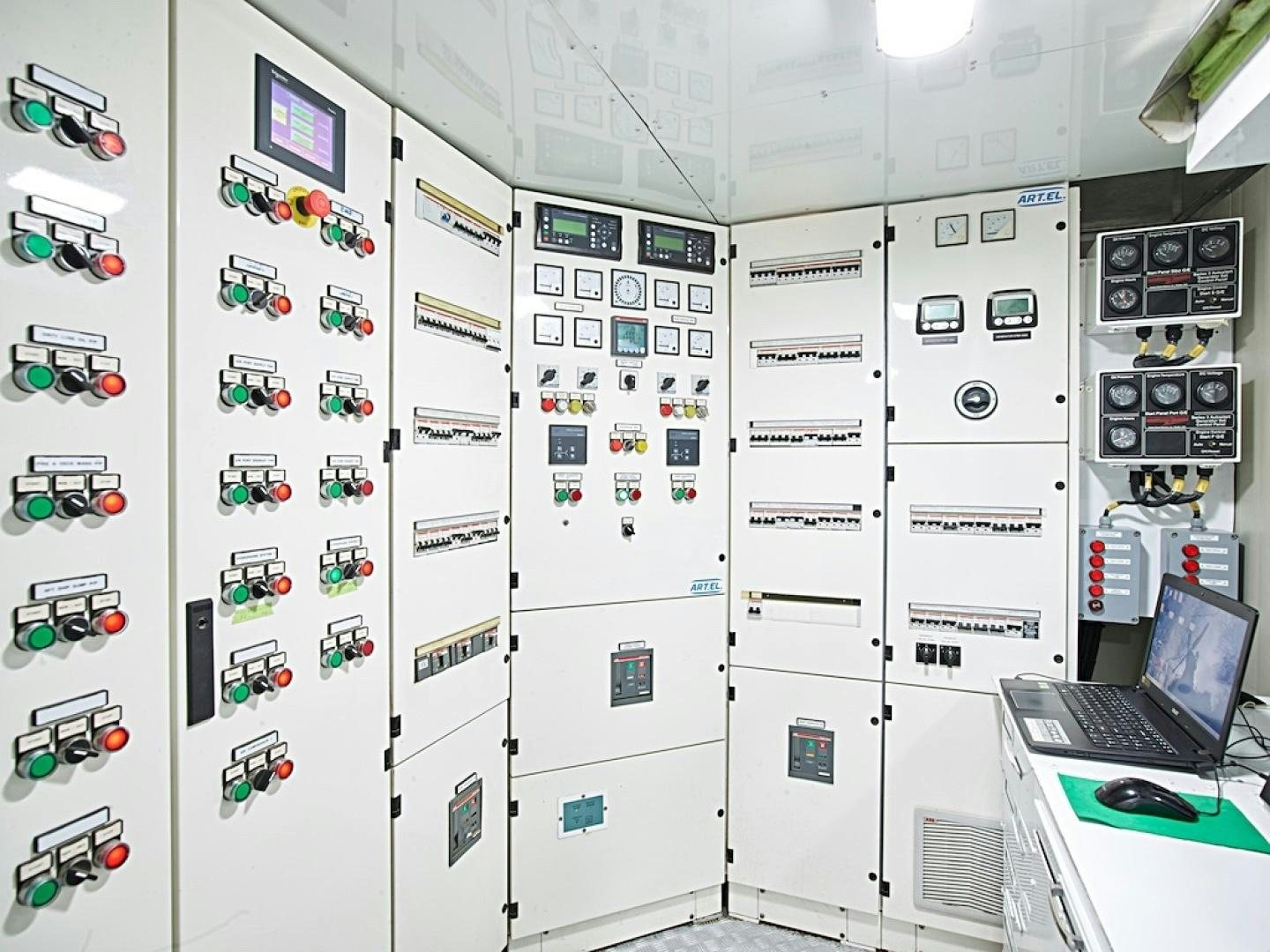 a wall of computer equipment aboard ALAIA Yacht for Sale