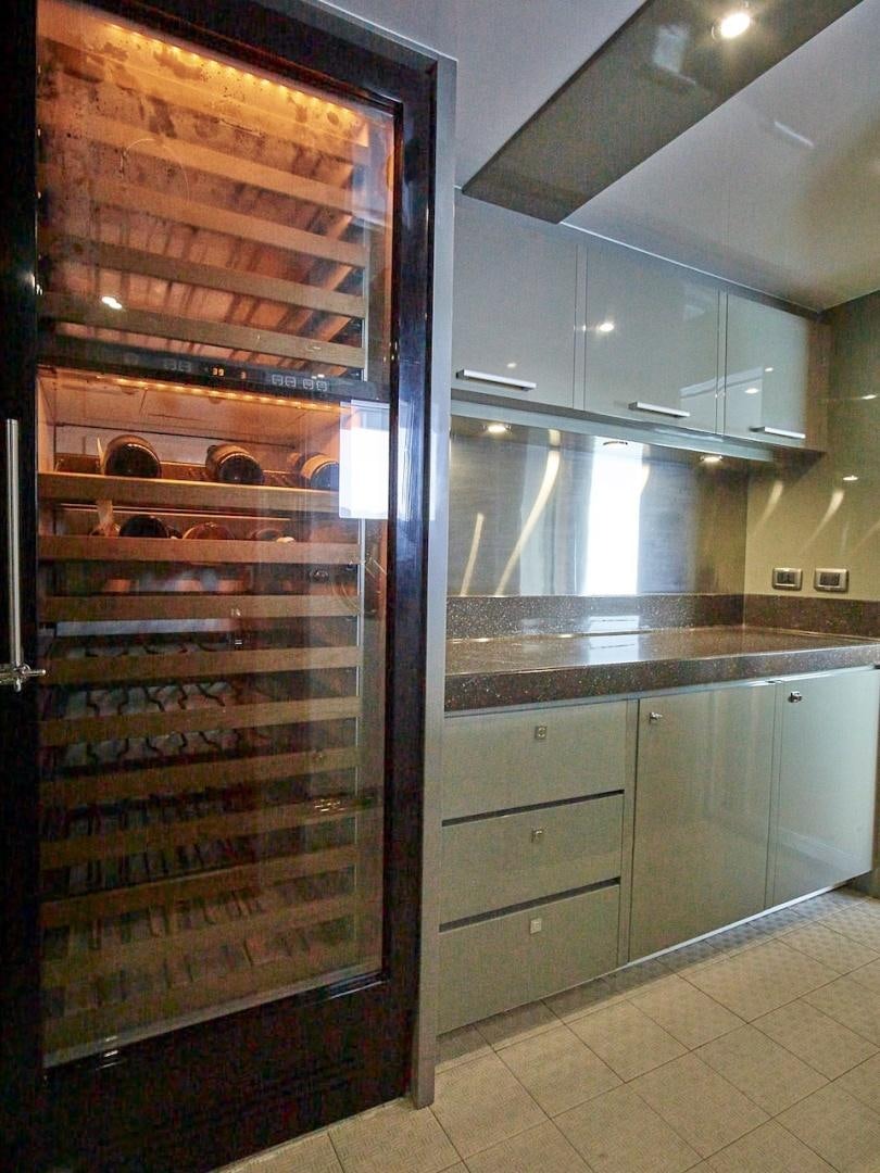 a kitchen with a large glass door aboard ALAIA Yacht for Sale