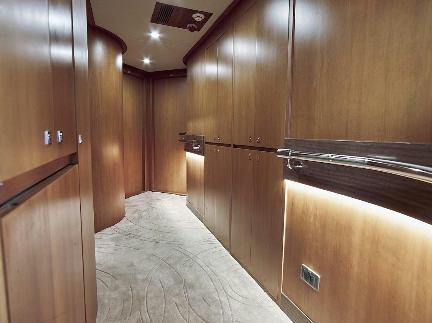 a room with wooden cabinets aboard ALAIA Yacht for Sale