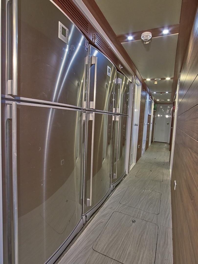 a hallway with a glass door aboard ALAIA Yacht for Sale
