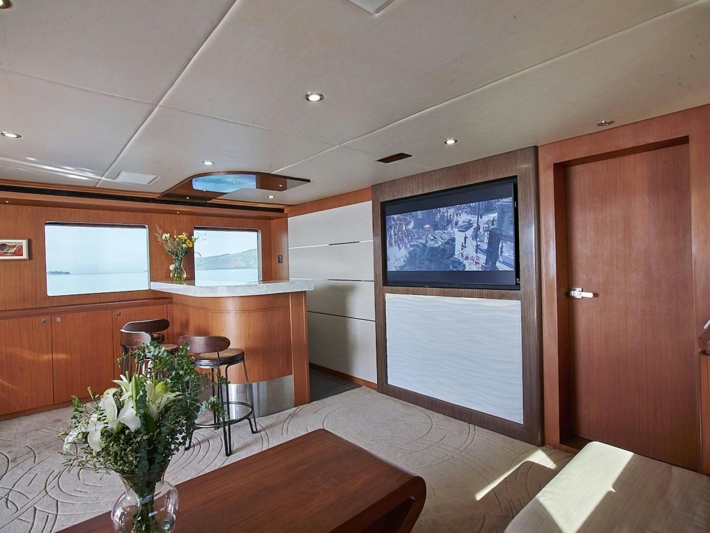 a room with a table and chairs aboard ALAIA Yacht for Sale