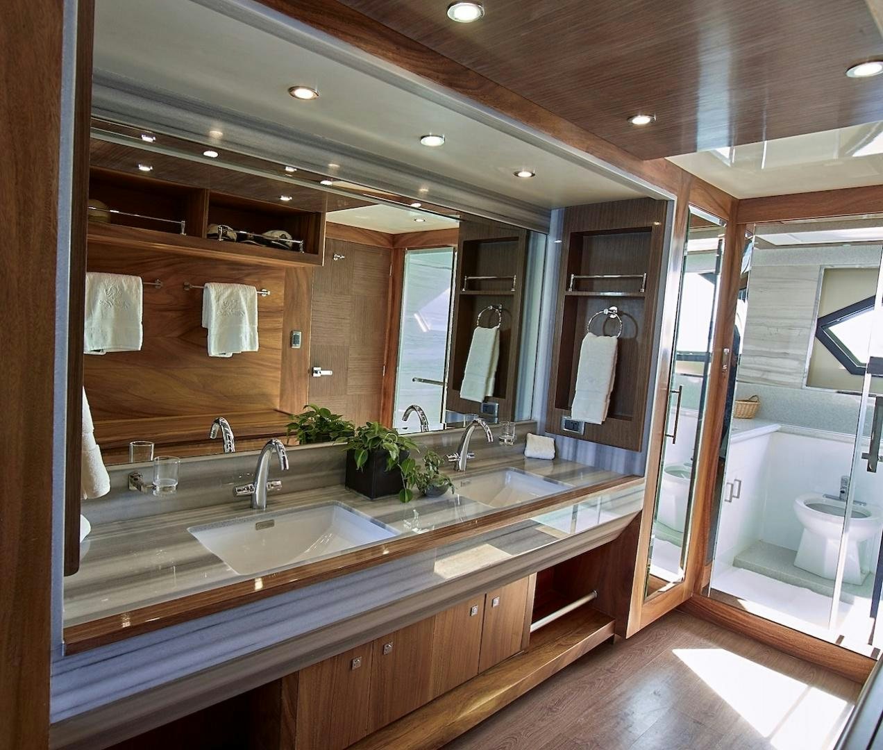 a bathroom with a large mirror aboard ALAIA Yacht for Sale