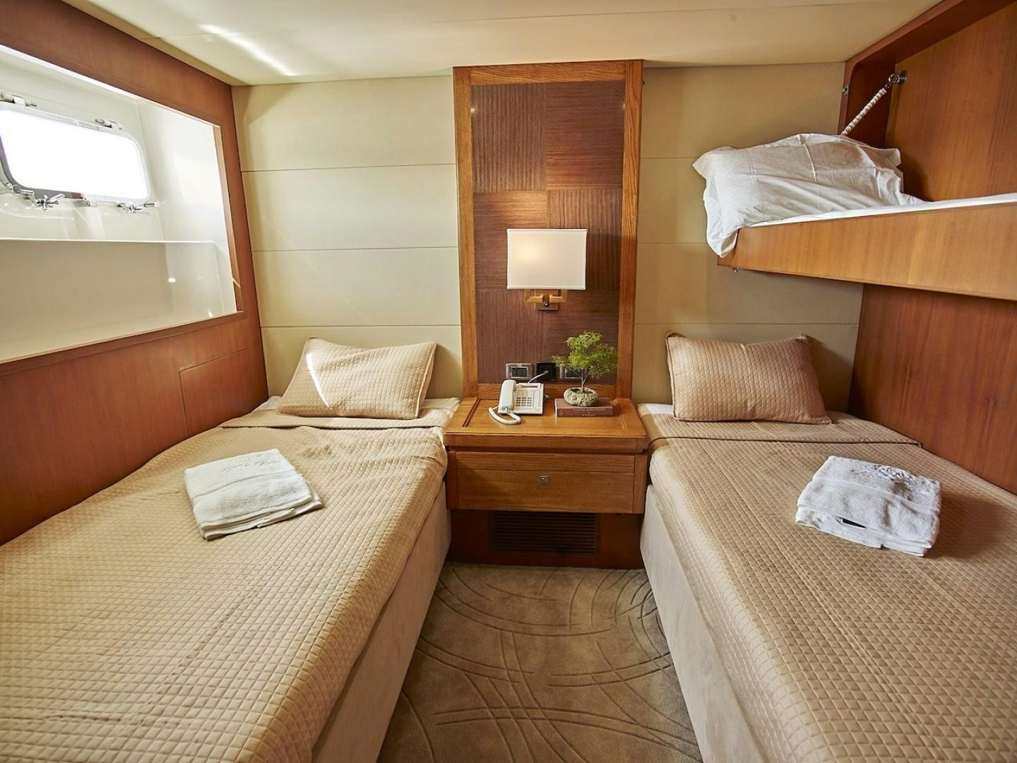 a hotel room with two beds aboard ALAIA Yacht for Sale