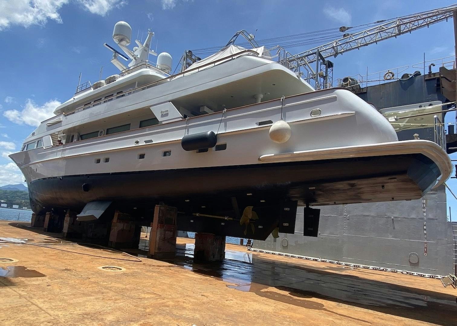 a large ship in a sandy area aboard ALAIA Yacht for Sale