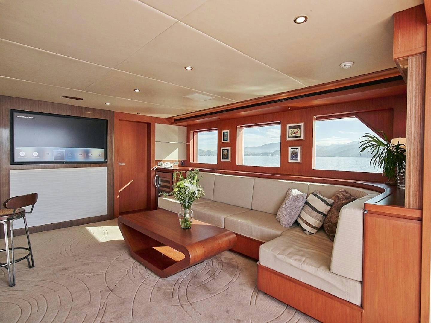 a living room with a couch and a tv aboard ALAIA Yacht for Sale