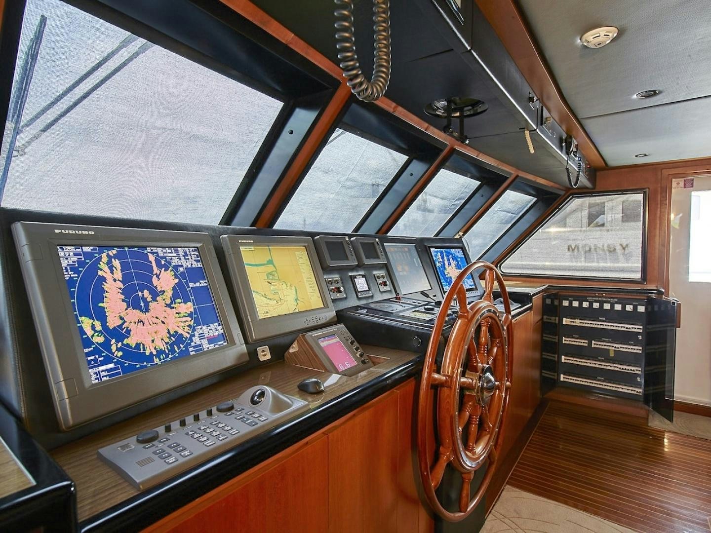 a control panel with a screen and a guitar aboard ALAIA Yacht for Sale