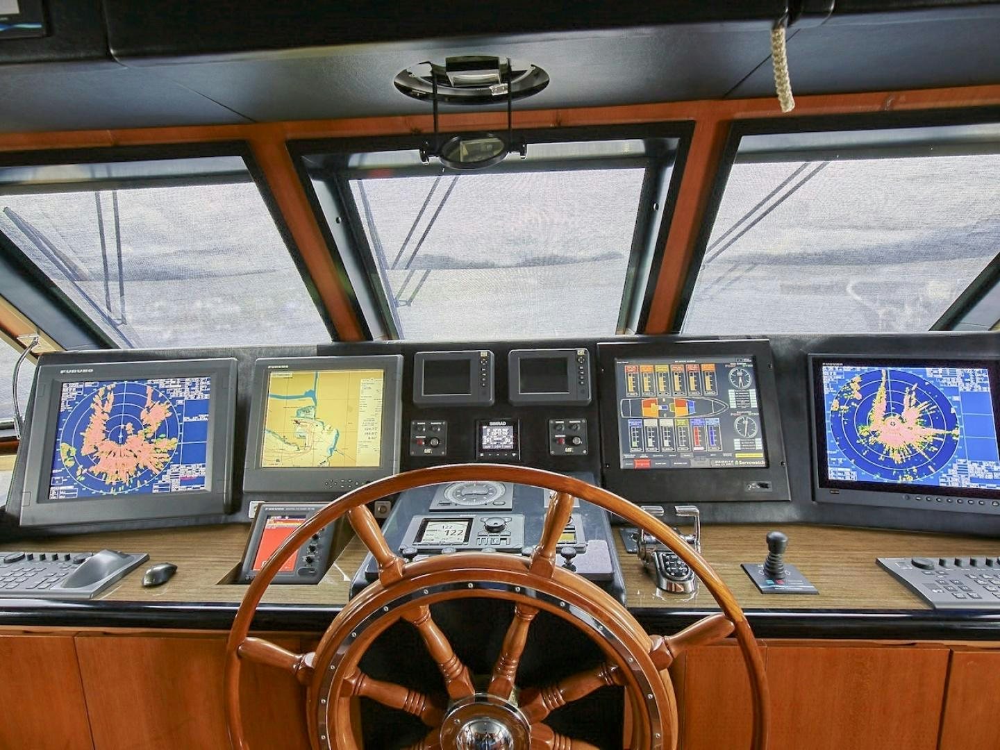 a control room with many monitors aboard ALAIA Yacht for Sale