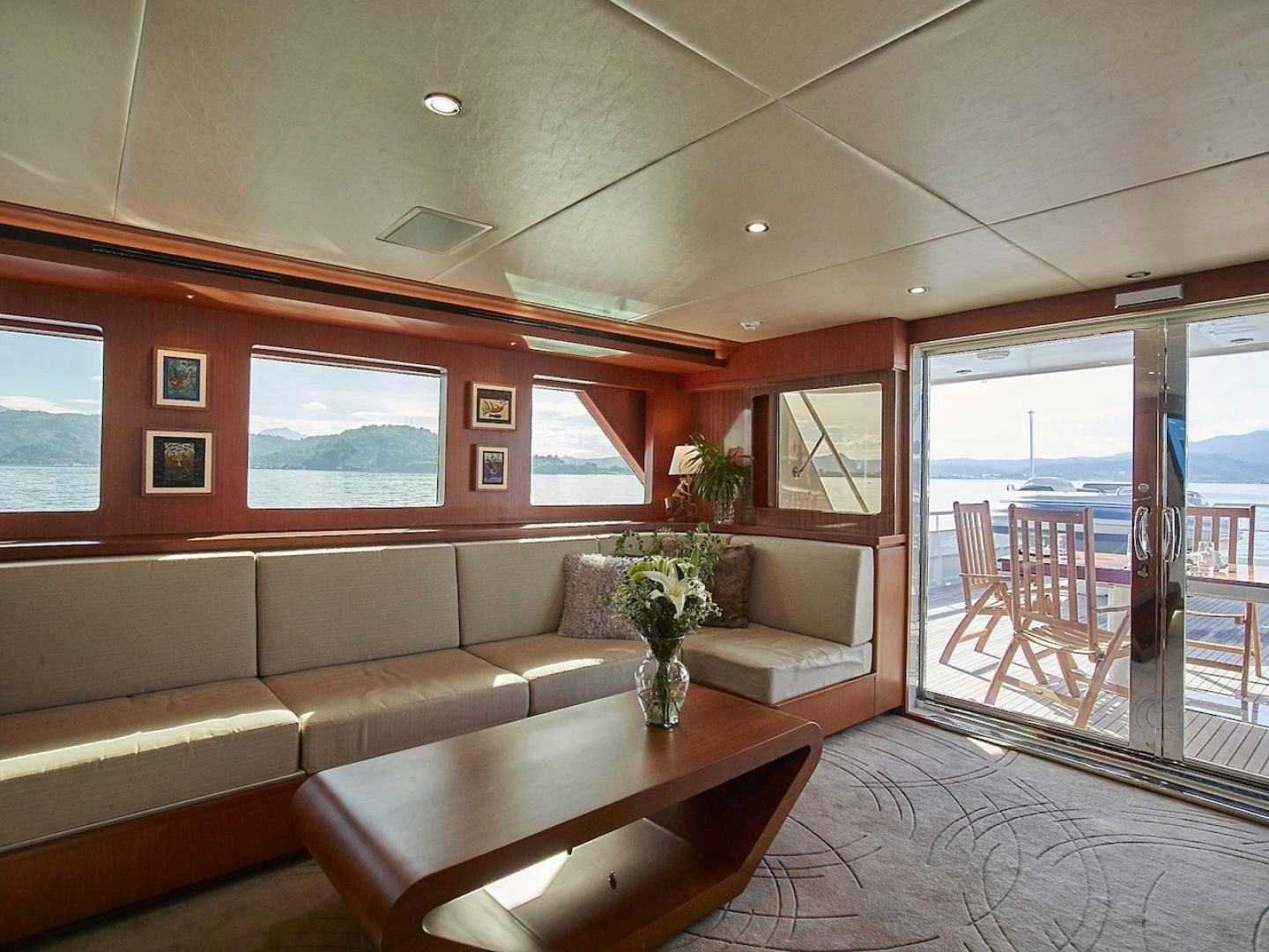 a living room with a couch and a table aboard ALAIA Yacht for Sale