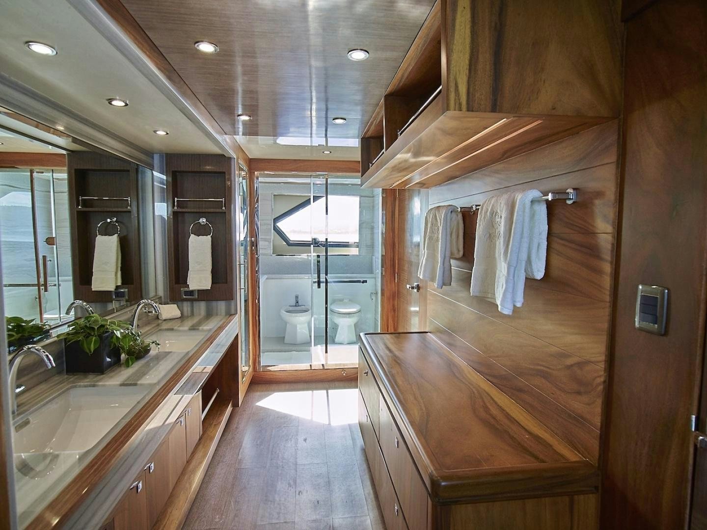 a bathroom with a large mirror aboard ALAIA Yacht for Sale