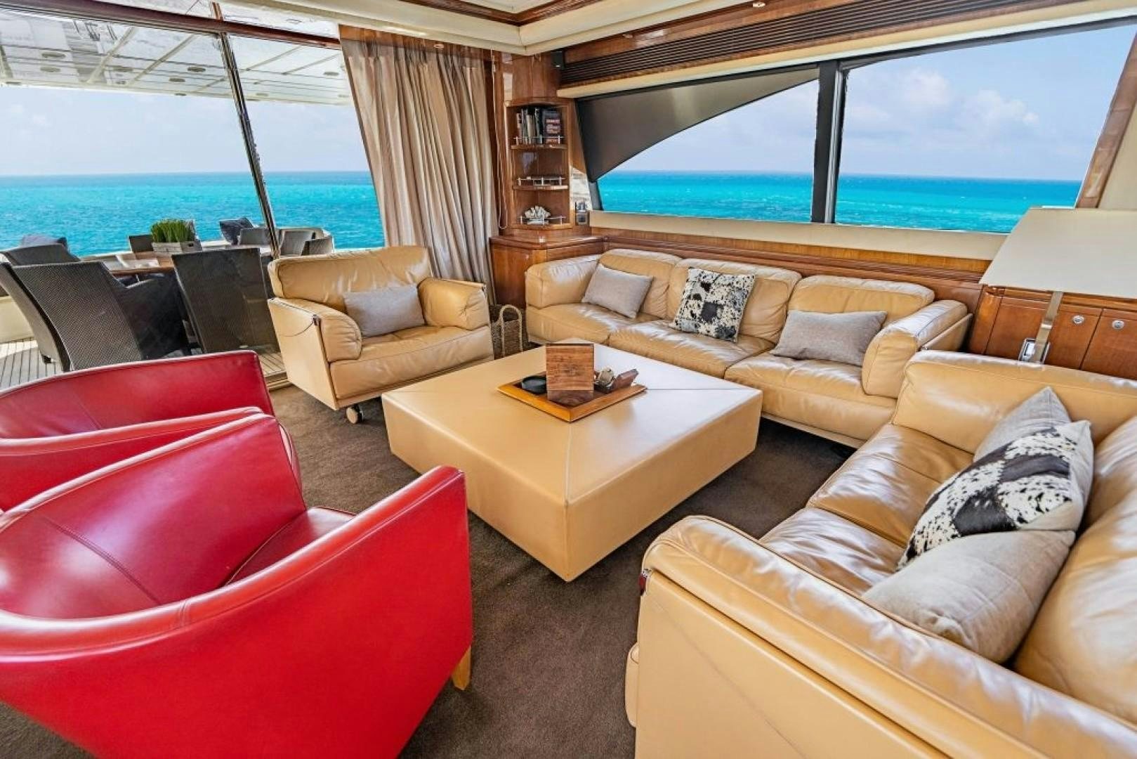 a living room with a large window aboard CINQUE MARE Yacht for Sale