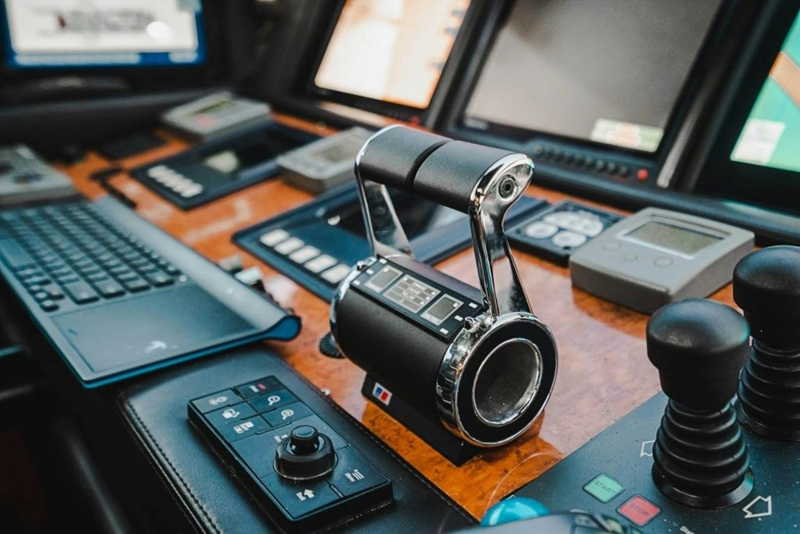 a black camera on a desk aboard CINQUE MARE Yacht for Sale