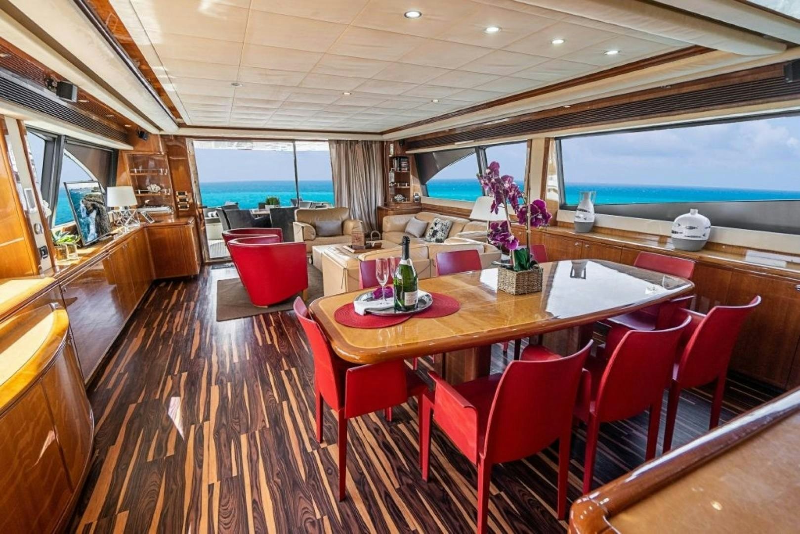 a dining room with a table and chairs aboard CINQUE MARE Yacht for Sale