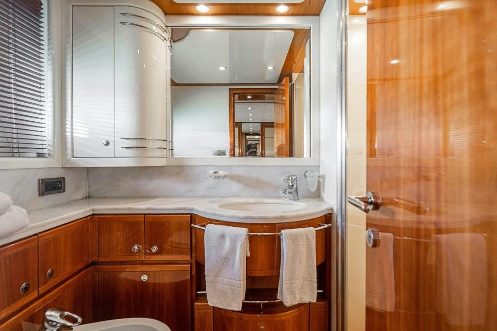 a bathroom with a sink and cabinets aboard CINQUE MARE Yacht for Sale