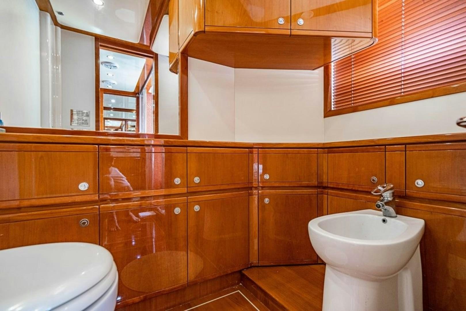 a bathroom with a glass shower aboard CINQUE MARE Yacht for Sale
