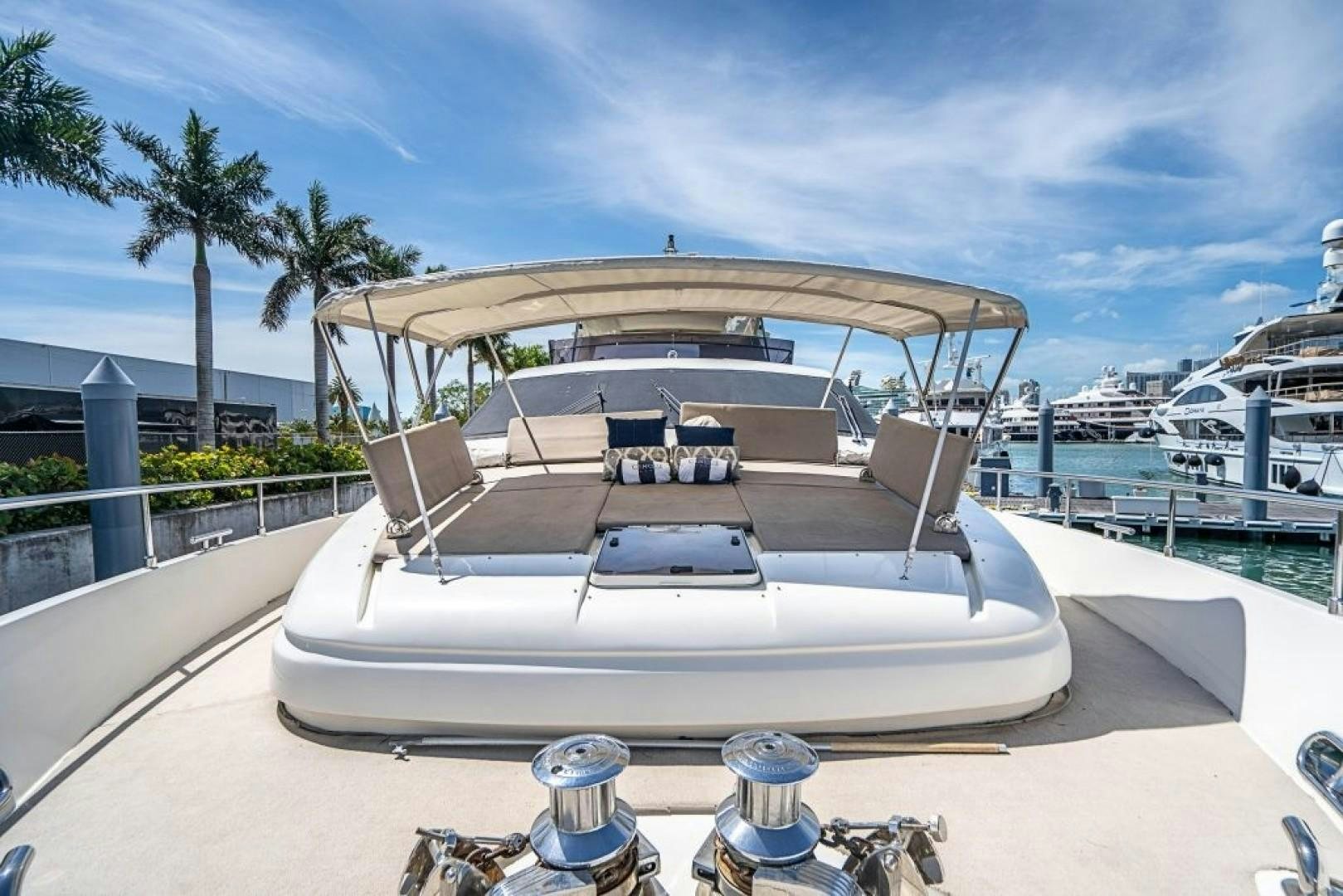 a white boat on a beach aboard CINQUE MARE Yacht for Sale