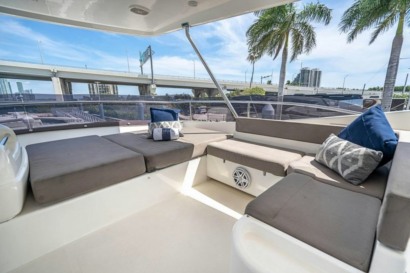a deck with a pool and lounge chairs aboard CINQUE MARE Yacht for Sale