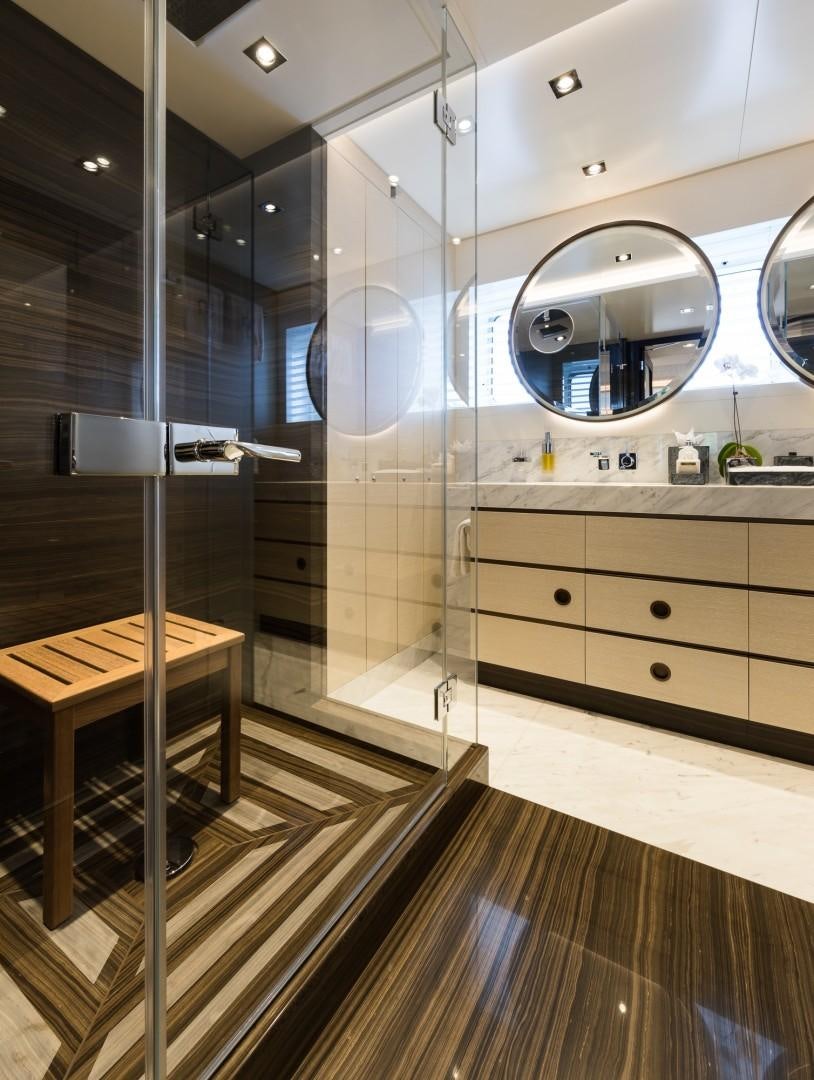 a bathroom with a large mirror aboard LAURENTIA Yacht for Sale