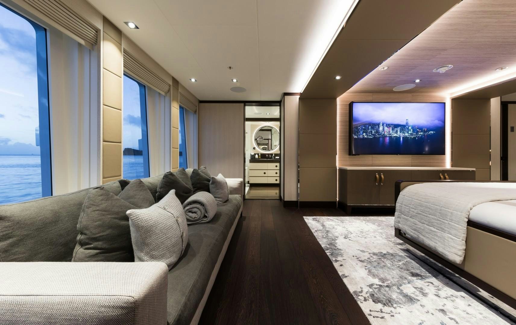 a living room with a large tv aboard LAURENTIA Yacht for Sale