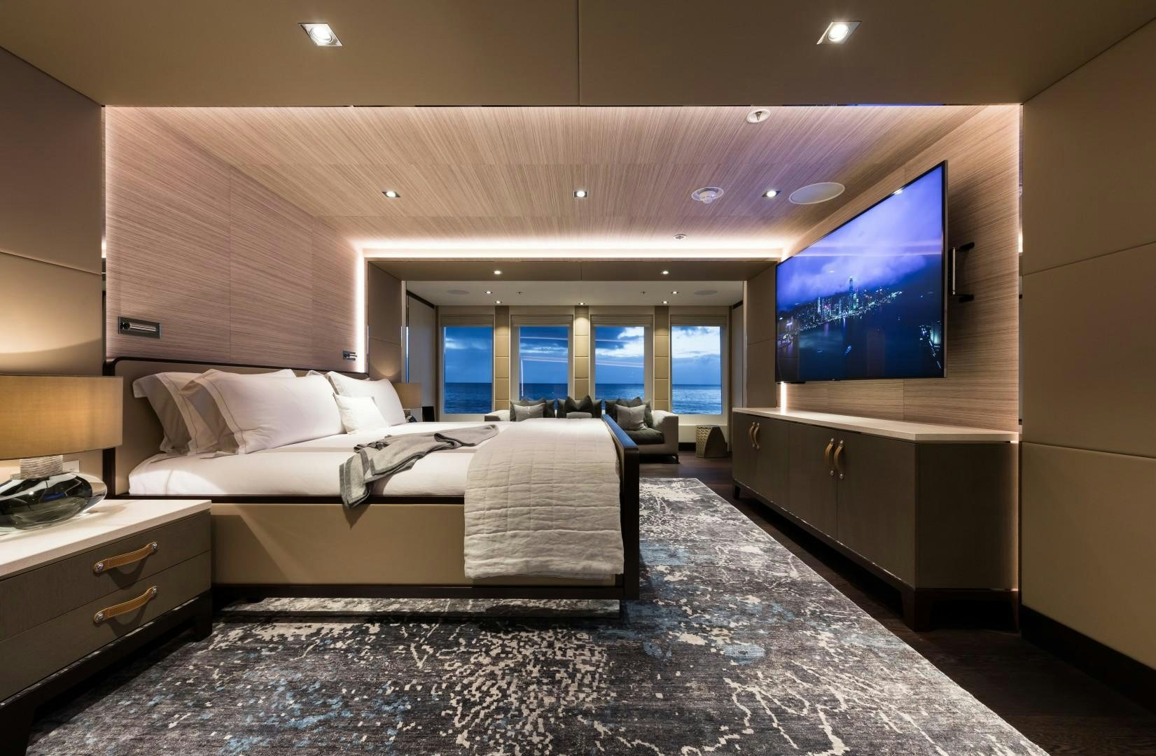 a room with a bed and a tv on the wall aboard LAURENTIA Yacht for Sale