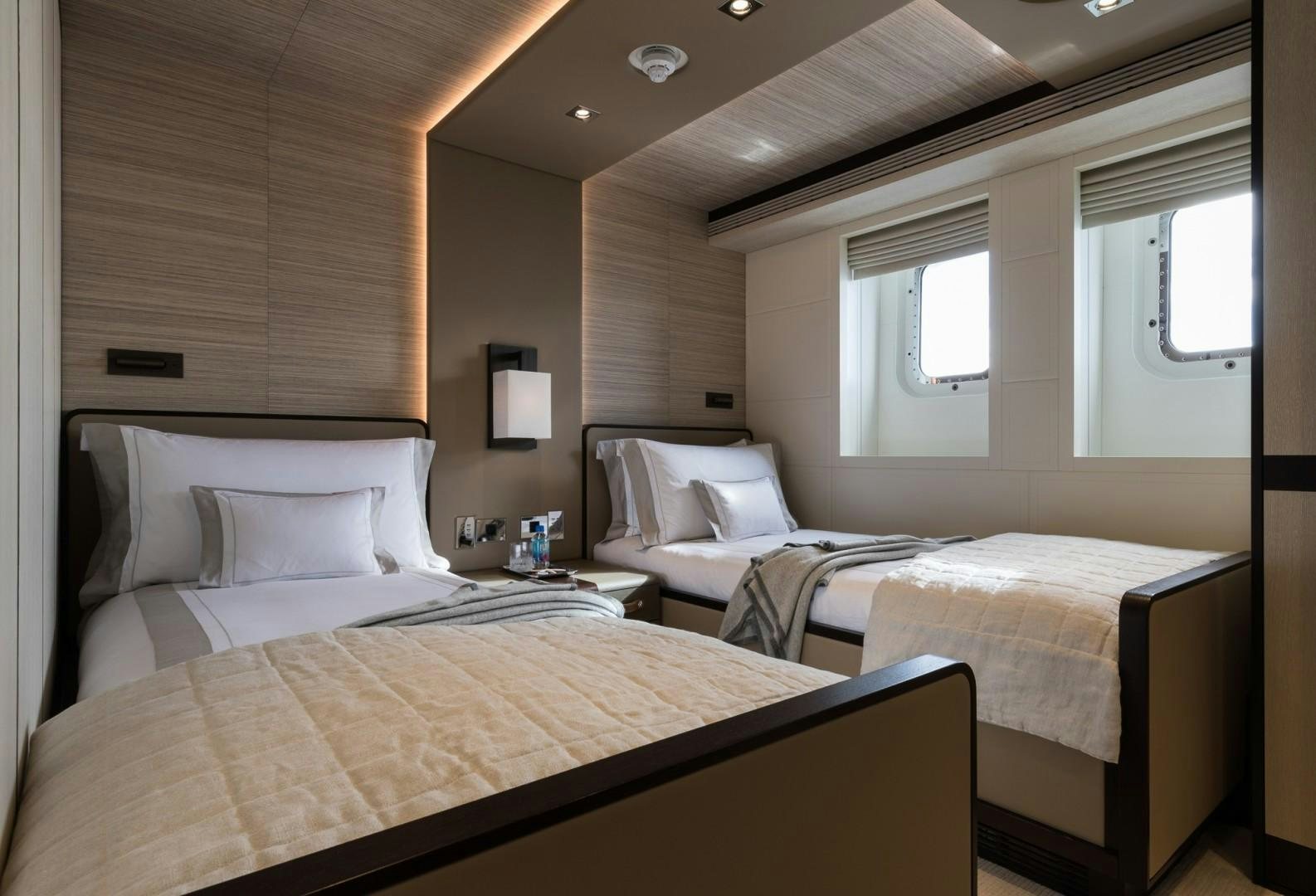 a couple of beds in a hotel room aboard LAURENTIA Yacht for Sale
