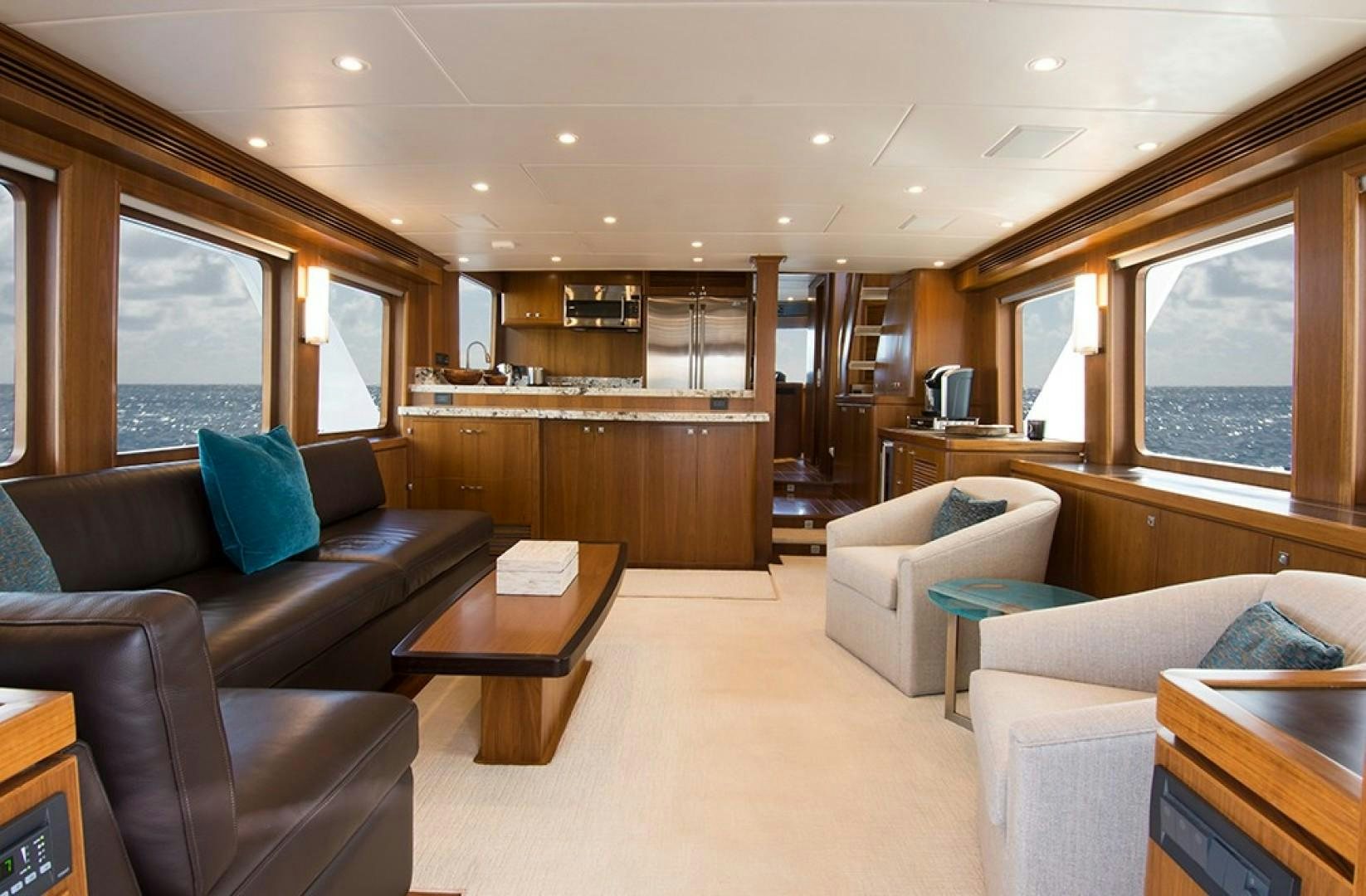 a living room with a couch and a coffee table aboard LET IT BEE Yacht for Sale