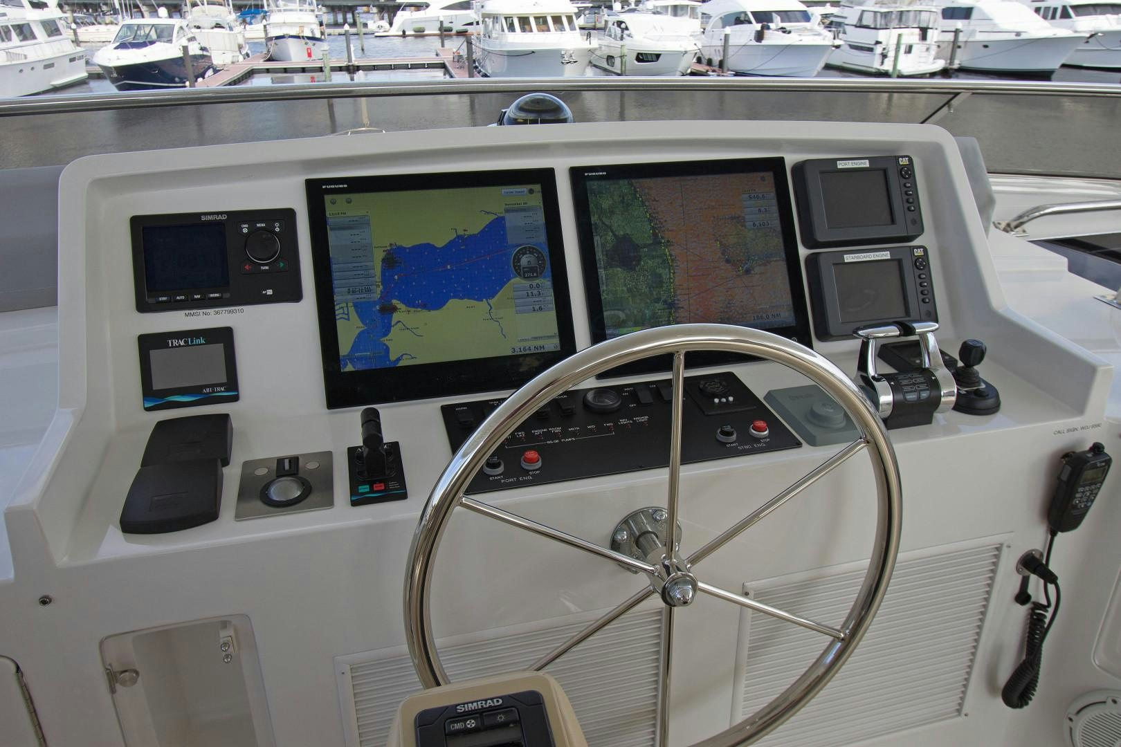 a white car with a screen and a steering wheel aboard LET IT BEE Yacht for Sale