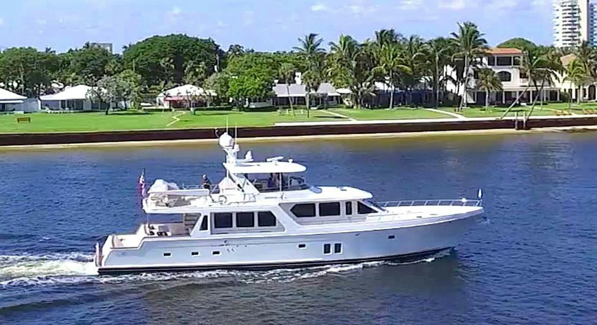 a white boat on water aboard LET IT BEE Yacht for Sale