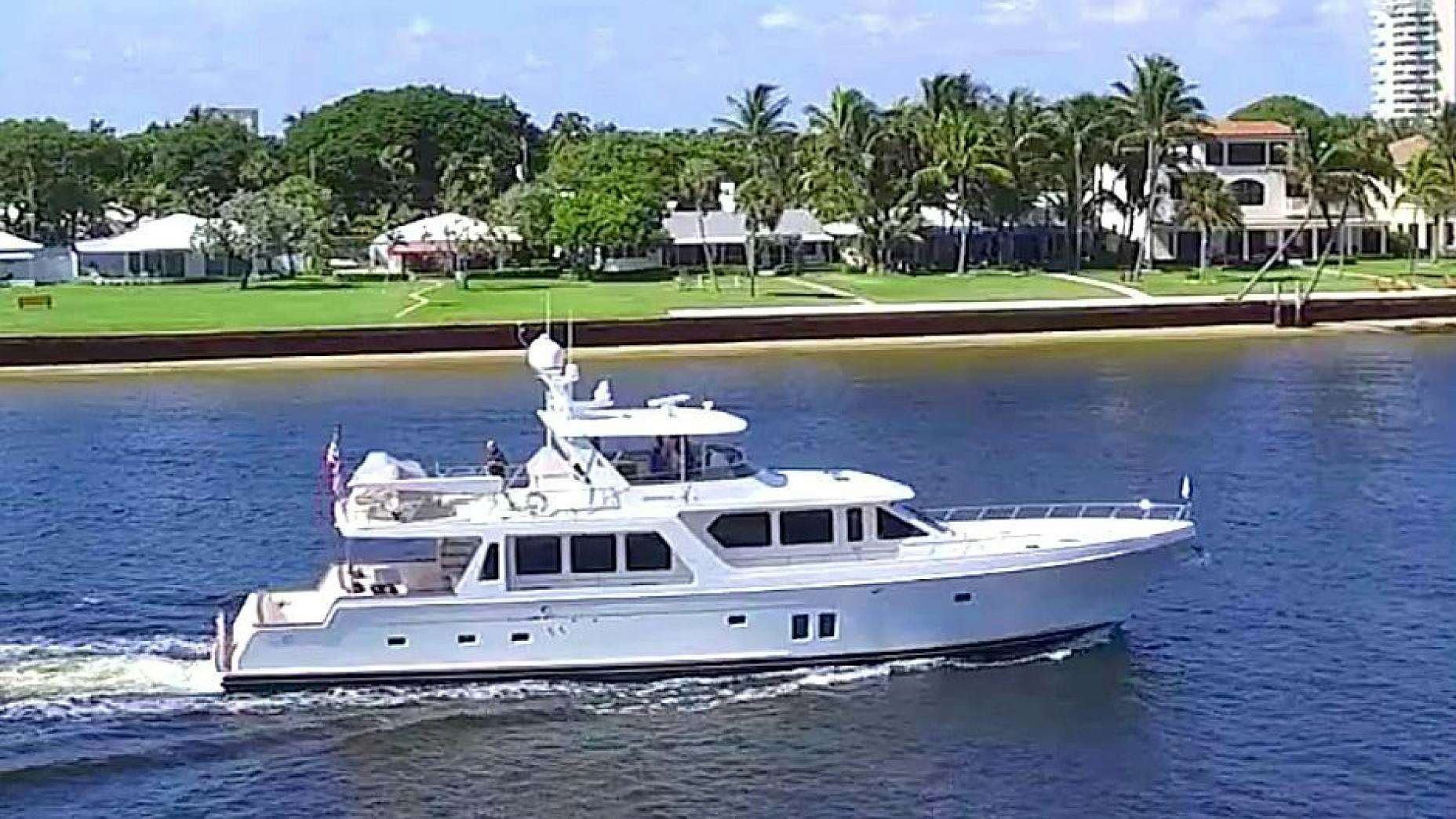 a white boat on water aboard LET IT BEE Yacht for Sale